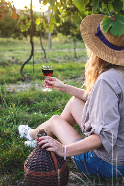 istock Young woman drinking red wine 1273537453