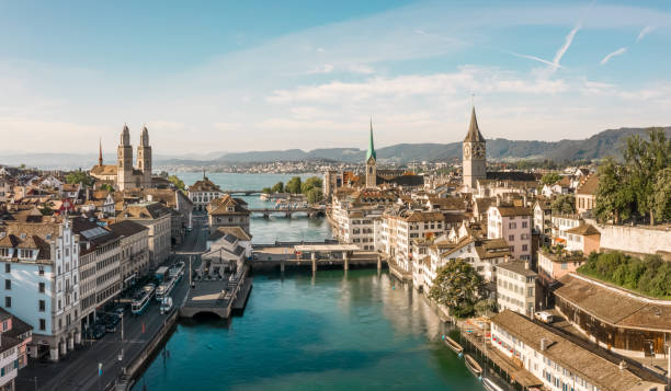 Skyline of Zurich with Limmat and Grossmünster Beautiful view of the Limmat and the Grossmünster from the air zurich photos stock pictures, royalty-free photos & images