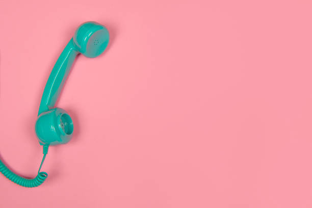 istock Blue retro telephone on a pink background with copy space 1273542243