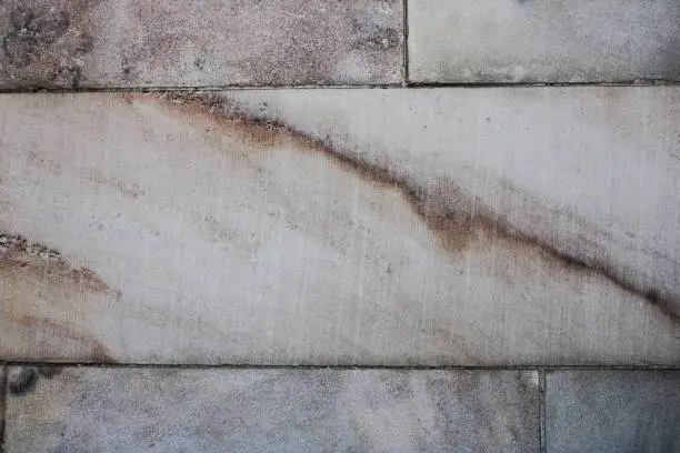 Photo of striations in white marble blocks