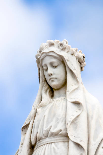 istock Angel, old statue of angle, light blue background with copy space 1273543227