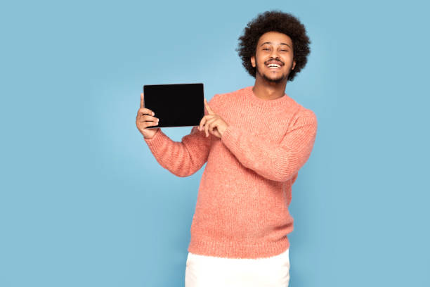 istock Happy African Man Holding Tablet 1273543346