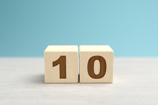 Wooden toy blocks forming the number 10.