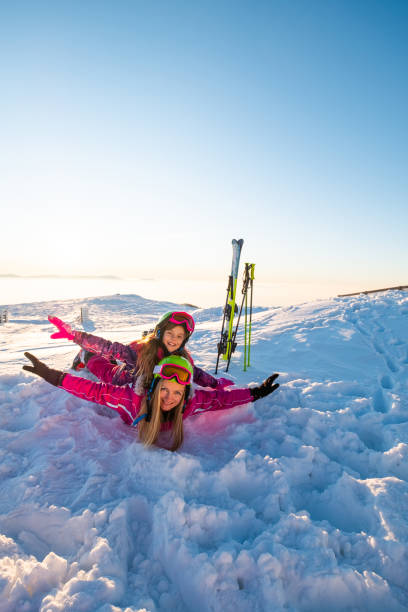 istock Mother and daughter on snow 1273549831