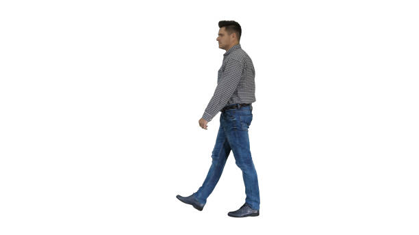 istock Casual man walking on white background 1273549922