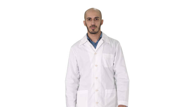 istock Walking male arab doctor on white background 1273549978