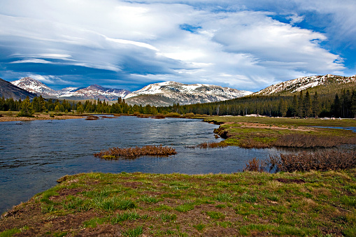 Mountains, lakes, and big stormy sky.