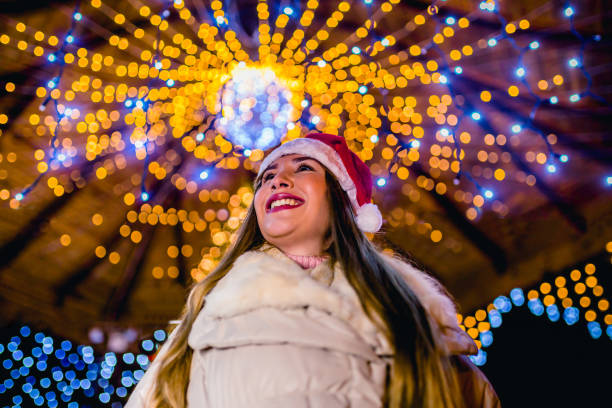 istock Woman surrounded by New Year’s decorations 1273554386