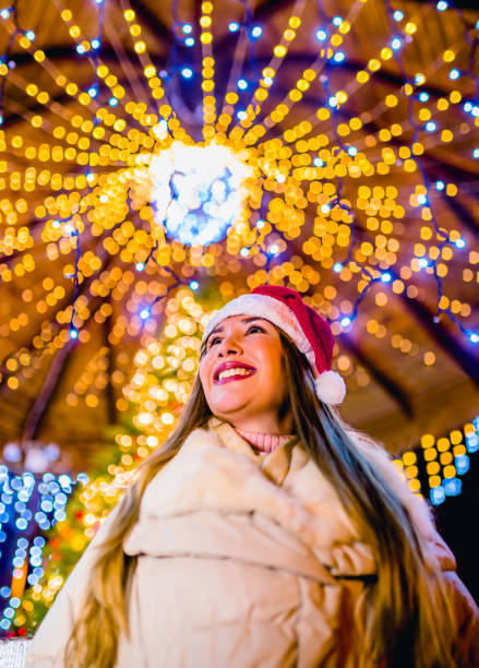 istock Woman surrounded by New Year’s decorations 1273554393
