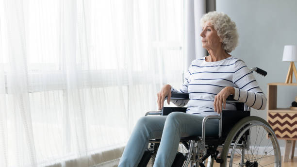 istock Pensive disabled elderly woman look in distance thinking 1273555389