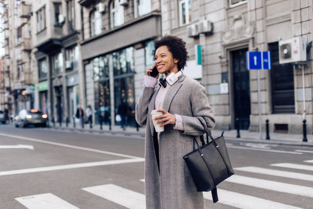 istock Charismatic lady crossing the street 1273555480