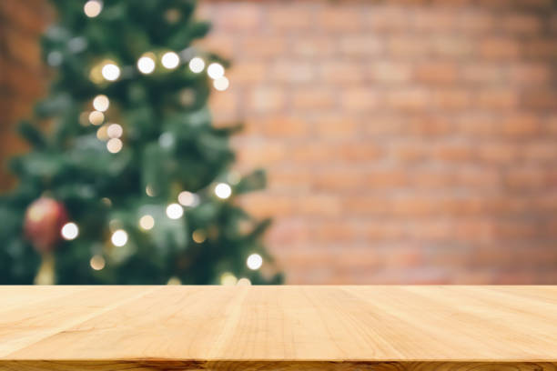 istock Empty wood table top with abstract blur decorated Christmas tree with baubles New Year holidays background for mockup product display 1273556046