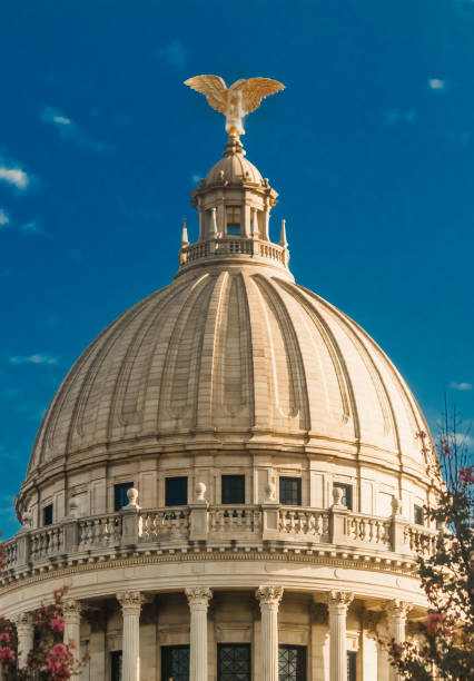 The Mississippi State Capitol dome under a blue sky