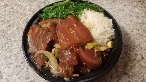 istock raw tuna and rice and onions in plastic container 1273564197