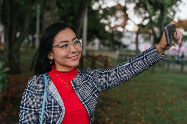 istock Woman taking selfie in smartphone 1273570964