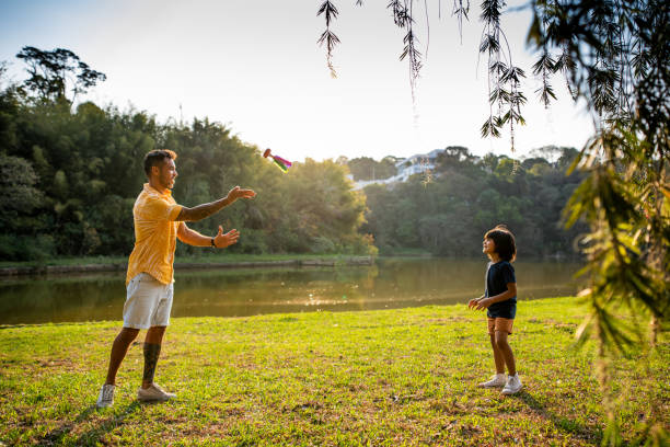 istock Father playing shuttlecock with son in nature 1273571963