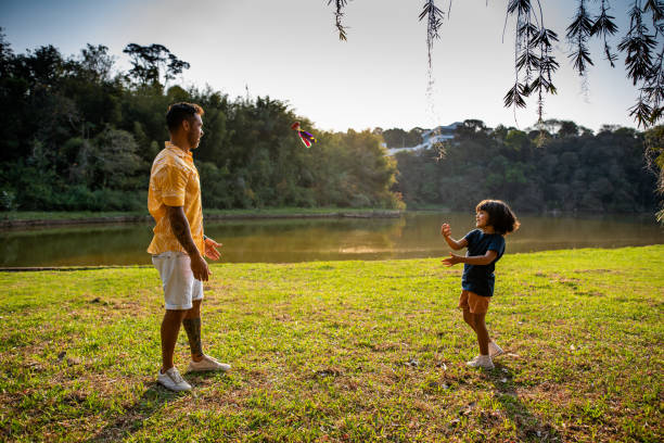 istock Father playing shuttlecock with son in nature 1273572001