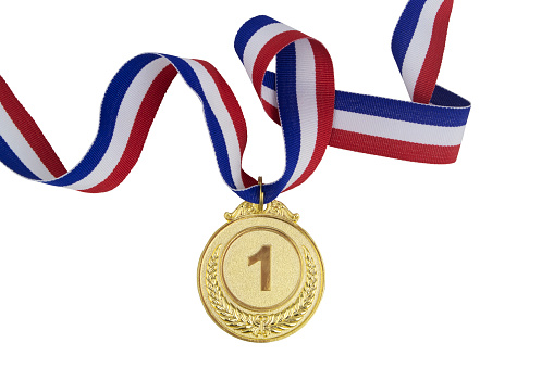 Golden medal with ribbon isolated on white background