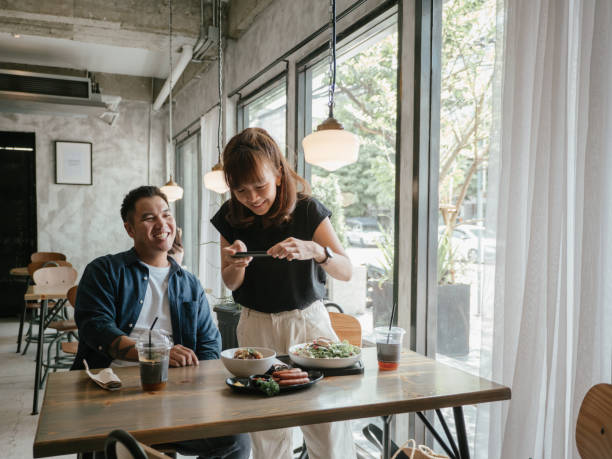 istock Asian young couples eating food at a cafe. 1273576847