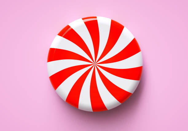 Round red and white lollipop on a pink background close-up. 3D rendering and 3D illustration.