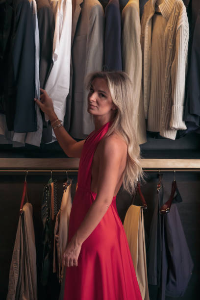 istock Woman stands in closet 1273581851