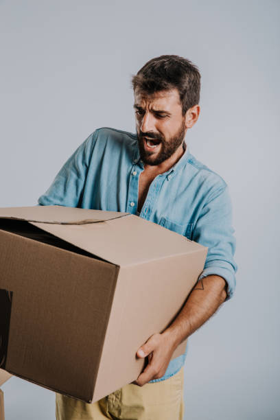 istock Trying not to break and drop the moving box 1273583466