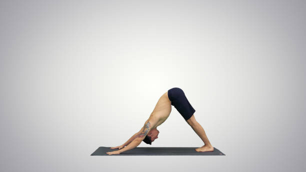 istock Profile of muscular handsome young man working out, standing in 1273586032