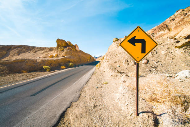 istock Turn sign when driving through Death Valley 1273586940