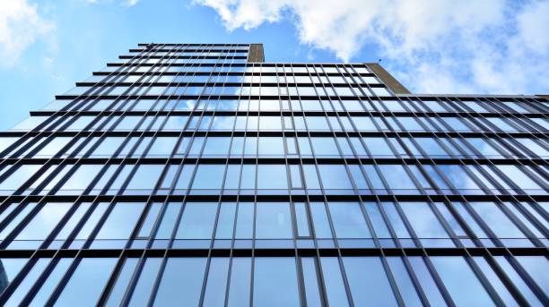 istock Office building, blue glass wall reflection detail. 1273587110