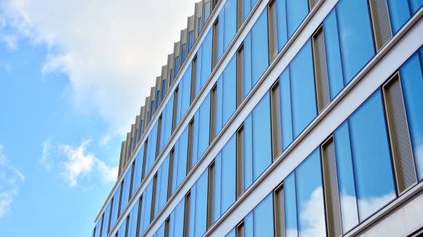 istock Office building, blue glass wall reflection detail. 1273587169