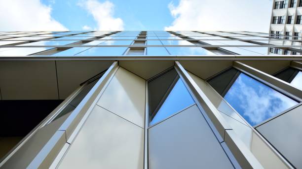 istock Office building, blue glass wall reflection detail. 1273587942