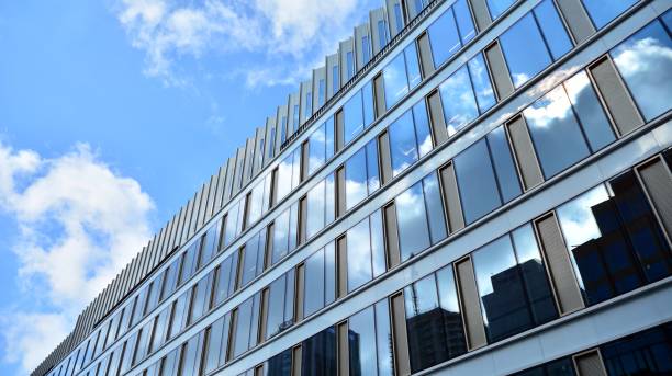 istock Office building, blue glass wall reflection detail. 1273587978