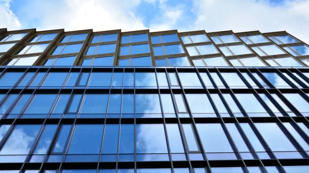istock Office building, blue glass wall reflection detail. 1273588081
