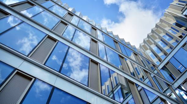 istock Office building, blue glass wall reflection detail. 1273588094