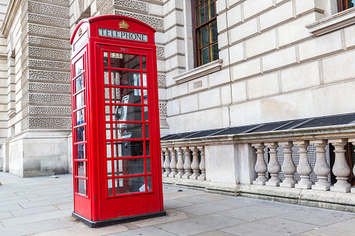 Red telephone box (booths) in London in a beautiful summer day, London, England, United Kingdom