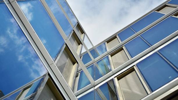 istock Office building, blue glass wall reflection detail. 1273588153