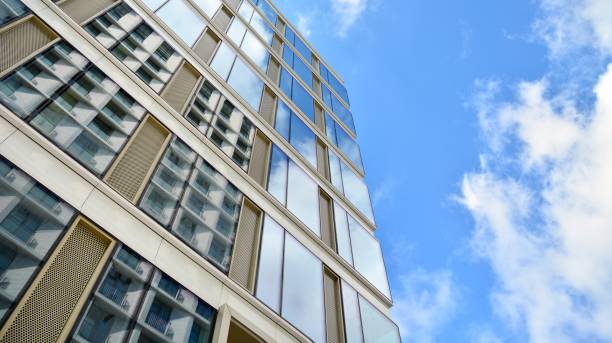 istock Office building, blue glass wall reflection detail. 1273588165