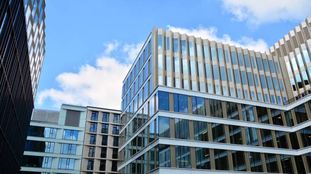 istock Office building, blue glass wall reflection detail. 1273588173
