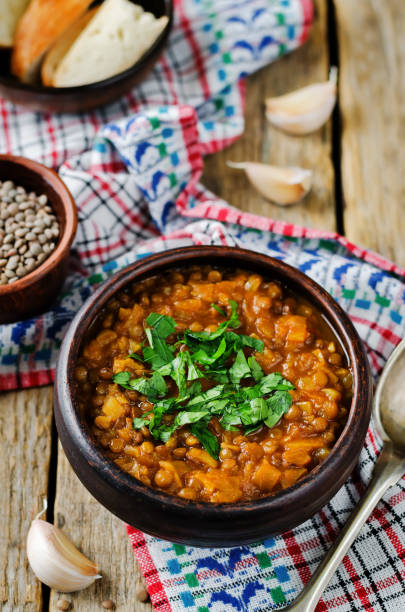 istock Cabbage Lentil stew in a bowl with parsley 1273594759