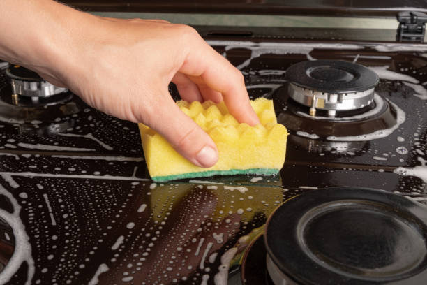 istock washing the gas stove in the kitchen 1273598759