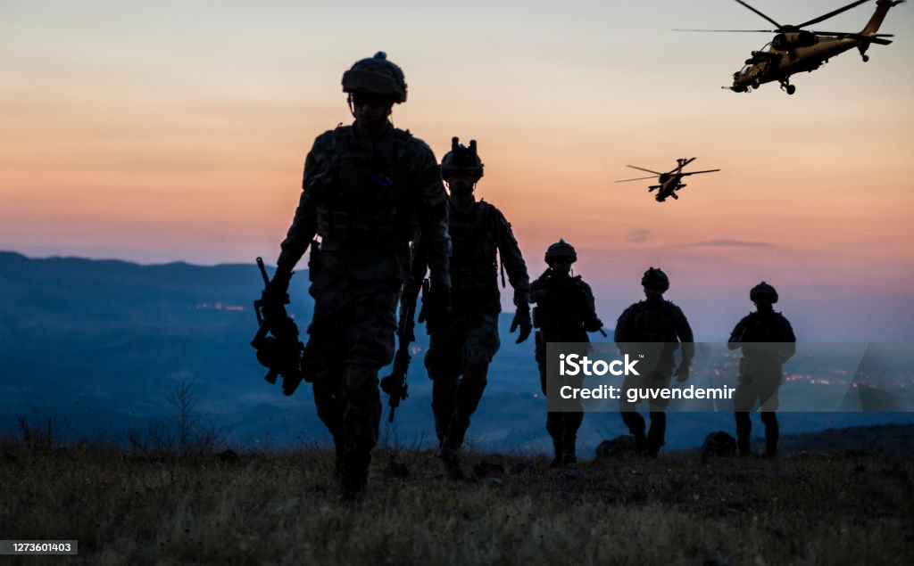 Military Mission at twilight War Stock Photo