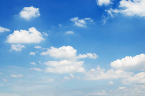 istock beautiful blue sky and white fluffy cloud horizon outdoor for background. 1273603939