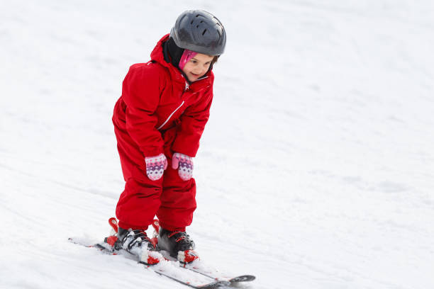 istock Little girl on ski 1273605940