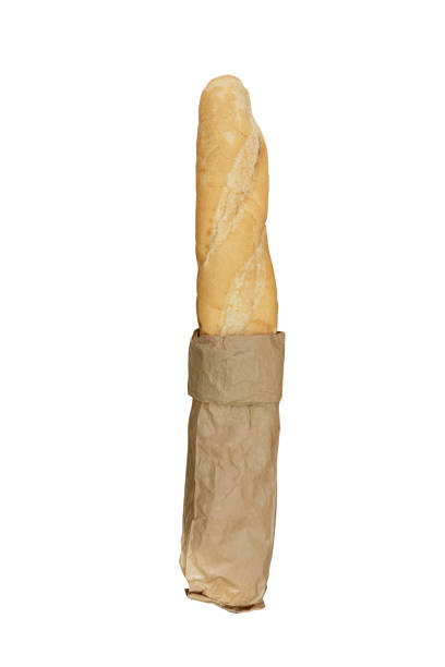 istock freshly baked bread in paper bag isolated on white background. 1273609054