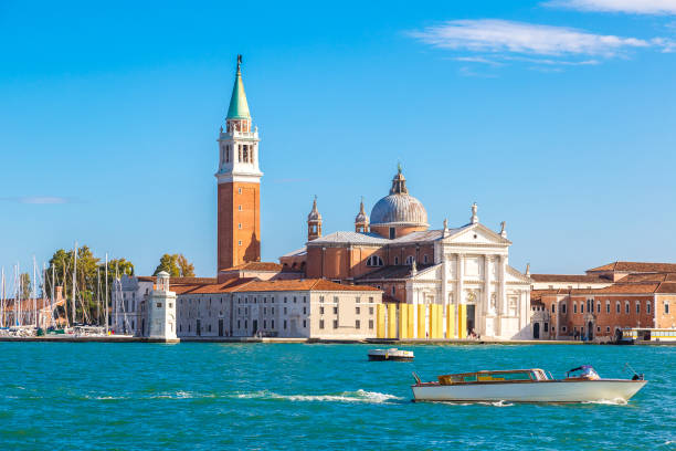 San Giorgio island in Venice, Italy San Giorgio island and boats in a summer day in Venice, Italy san giorgio maggiore stock pictures, royalty-free photos & images