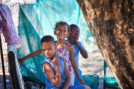 Daily African  life in an a village in the rural  Botswana , kids playing in the yard