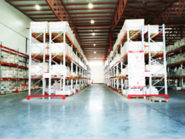istock Shelving System With Boxes in Distribution Warehouse, Large industrial warehouse with high racks 1273630396