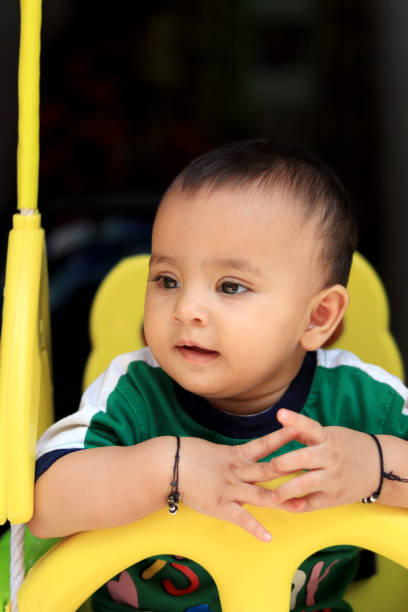 istock Carefree toddler swinging on a swing 1273631998