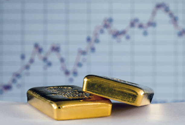 istock Gold bars on the background of the growth chart. 1273634122