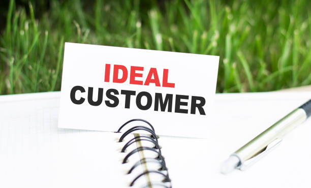istock White card with text Ideal customer en against greenery background 1273634155